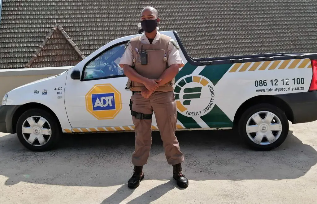 Security guard in front of car