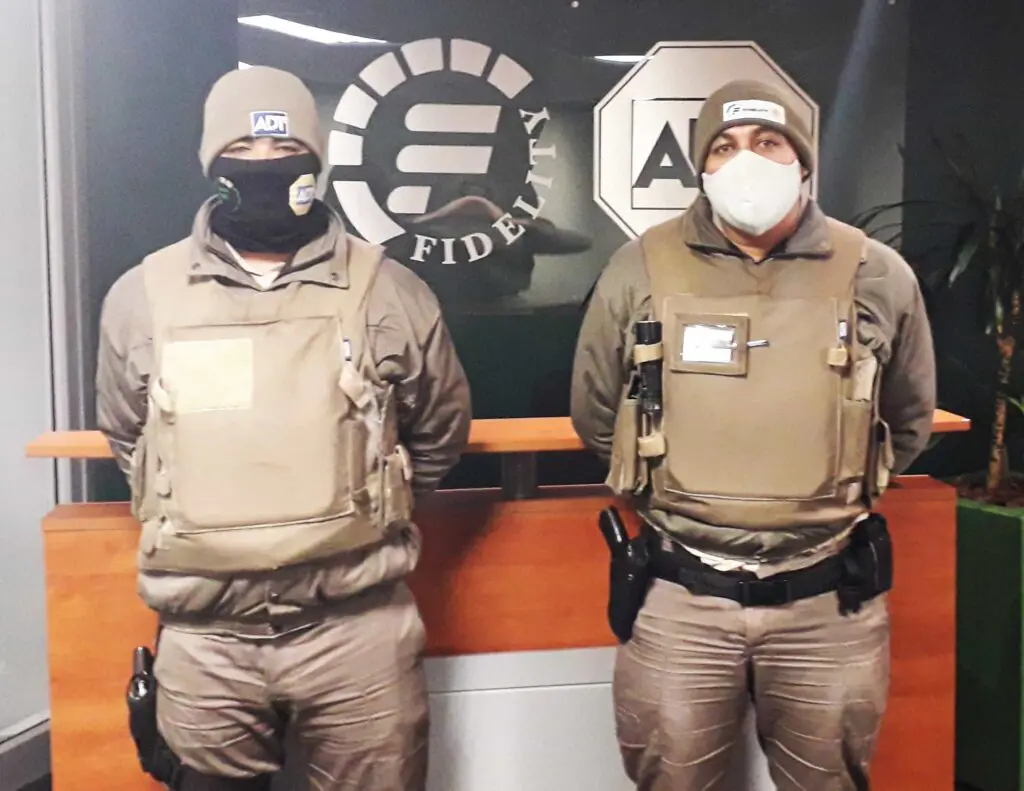 Two security guards with masks