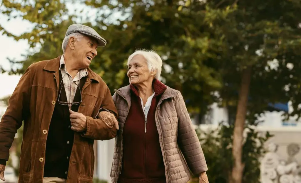 elderly couple smiling at each other