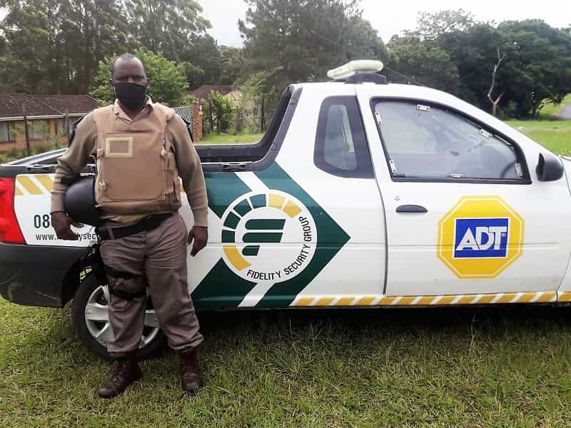 ADT security guard next to response vehicle