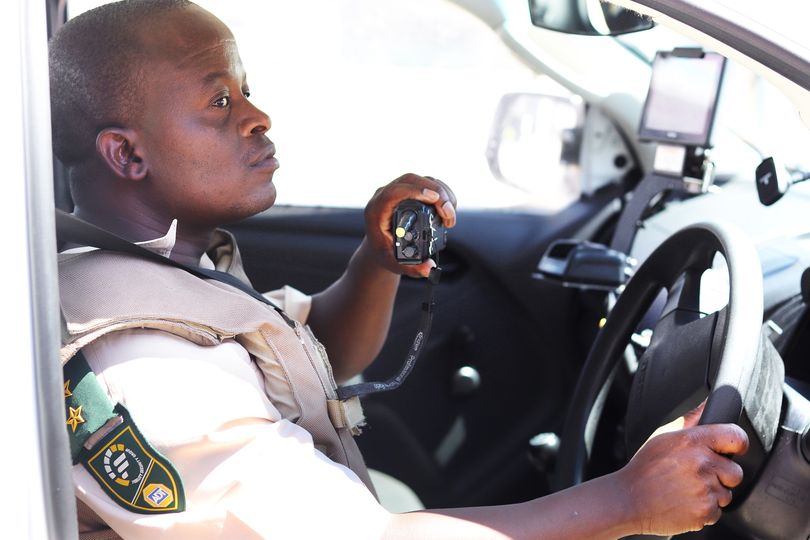 Officer on radio in car