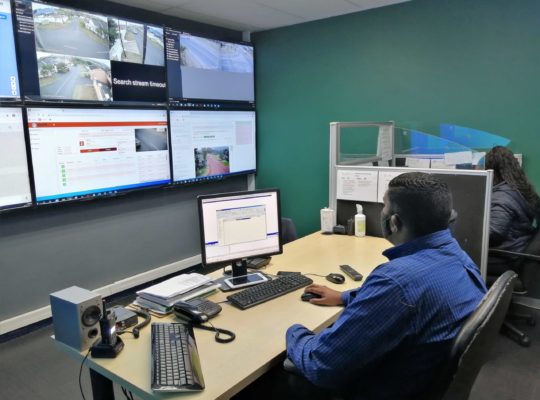 People sitting in a Community Control Room