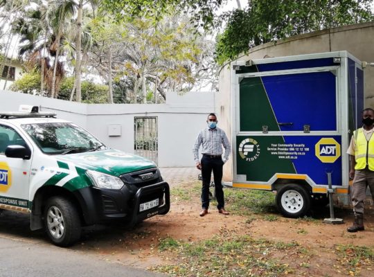 Mobile Trailer next to adt security guards