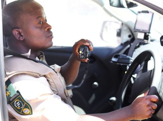 Officer on radio in car